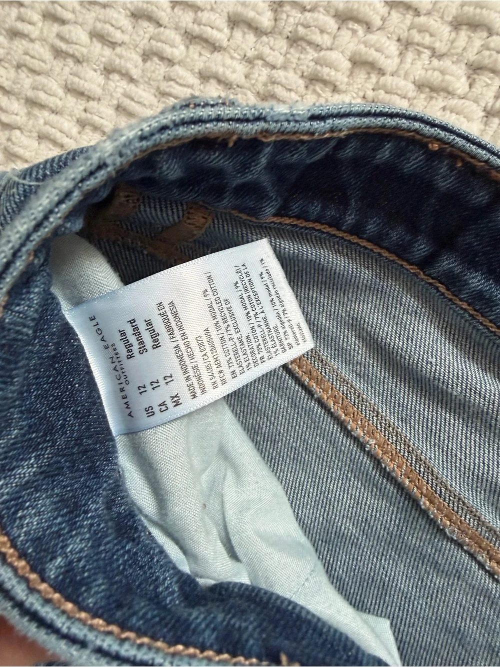 American Eagle Outfitters High-Rise Blue Distressed Stretch Jeans